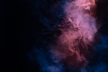 Obraz premium Blue and pink steam on a black background.