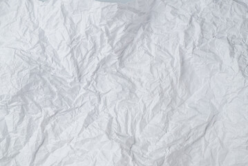 Crumpled white paper background.