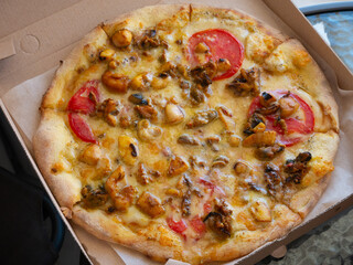 Seafood pizza as a background. Junk food.