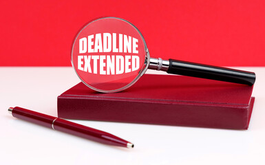On a white and red background, a notebook, a pen and a magnifying glass, inside which the inscription Deadline Extended
