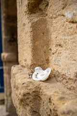 Obraz na płótnie Canvas lost baby pacifier on an old white stone wall