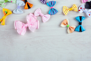 multi-colored decorative fabric bows on a wooden table top view