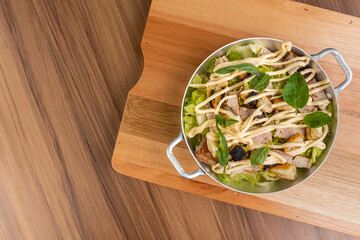 Tuna salad with croutons, lettuce and tomato