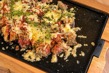 Appetizer - filet parmigiana with mozzarella cheese and tomato sauce