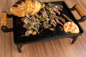 Appetizer - Fillet strips with garlic, and garlic bread on the side