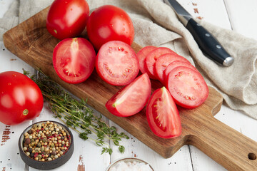Fresh red tomatoes, close-up of fresh, ripe tomatoes on wooden background