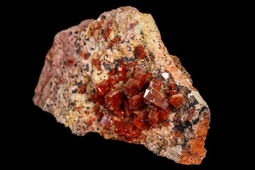 Macro mineral stone Vanadinite on a black background