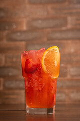 Refreshing strawberry drink with orange