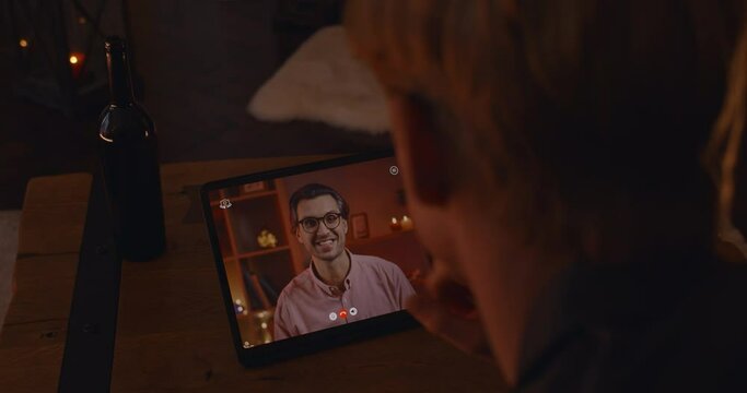 Couple of two gays smiling and talking during online dating