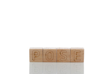 Naklejka premium Wooden cubes with letters pose on a white background
