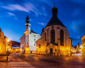 Fototapeta na wymiar Night street with gothic church
