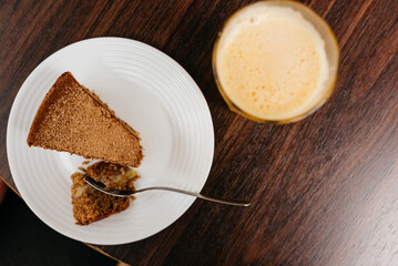 slice of banana cake with glass of orange juice