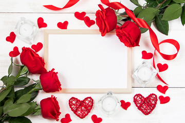Valentine's day concept. Red roses, hearts and gift boxes on a white background. Mockup, place for text.