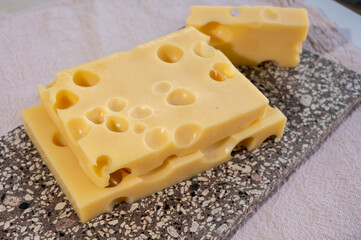 Cheese collection, semi-hard French cheese emmentaler with round holes made from cow milk