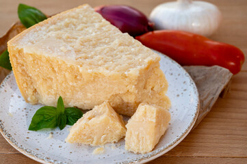 Cheese collection, piece of matured cow cheese pasmesan parmigiano reggiano made from cow milk