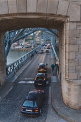 Cars drive on a road bridge across the Douro River in the Portuguese city of Porto
