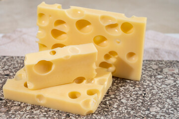 Cheese collection, semi-hard French cheese emmentaler with round holes made from cow milk