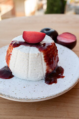 Cheese collection, white Italian soft cheese ricotta served as sweet dessert with homemade plum jam