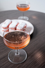 Symbols of Reims - glasses of rose brut champagne and rose biscuits