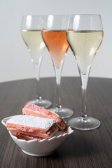 Symbols of Reims, glasses of white and rose brut champagne and rose biscuits