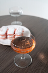 Symbols of Reims - glasses of rose brut champagne and rose biscuits