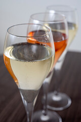 Tasting of white and rose champagne sparkling wine from flute glasses