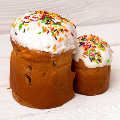 Traditional Easter russian orthodox cakes kuliches on white wooden boards