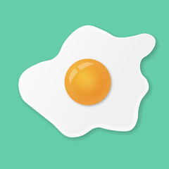 Fried egg or scrambled eggs isolated on green menthol background