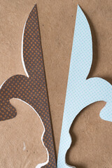 stylized floral shapes on plain brown paper