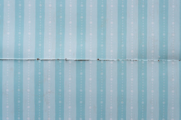 paper background with stripes and dot pattern and torn edge element