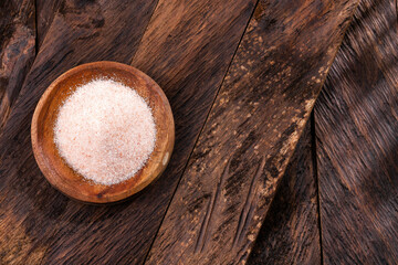 Fine-grained Himalayan pink salt and crystals in the wooden bowl