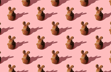 Pattern of soft toy bunny on pink pastel background