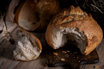 Fresh wheat bread on a wooden rustic table