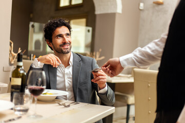 Man paying the bill with a credit card