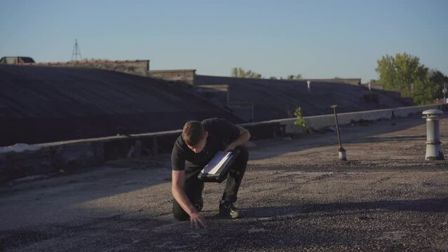 Roofing project manager supervising a flat roof build