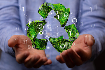 hand holding green recycle symbol