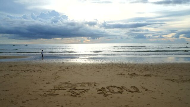 timelapse tropical beach with i love you written on sand