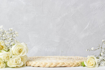 Natural braided catwalk and beautiful little roses. A showcase with a stage for natural products.