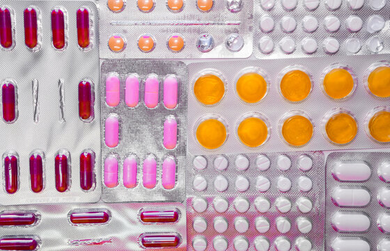 Background full of different and colorful pill blisters or medicines