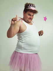 I've got something for you. Shot of an obese man wearing a fairy costume.