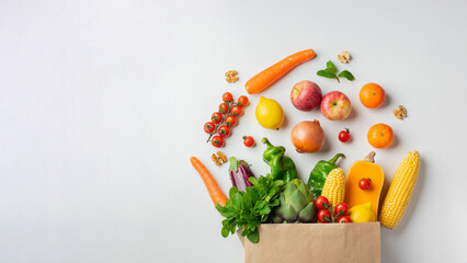 Delivery healthy food background. Healthy vegan vegetarian food in paper bag vegetables and fruits on white, copy space, banner. Shopping food supermarket and clean vegan eating concept