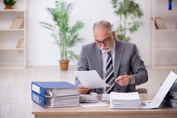 Old male employee and too much work in the office