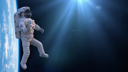 Fototapeta premium astronaut during a space walk in orbit of planet Earth