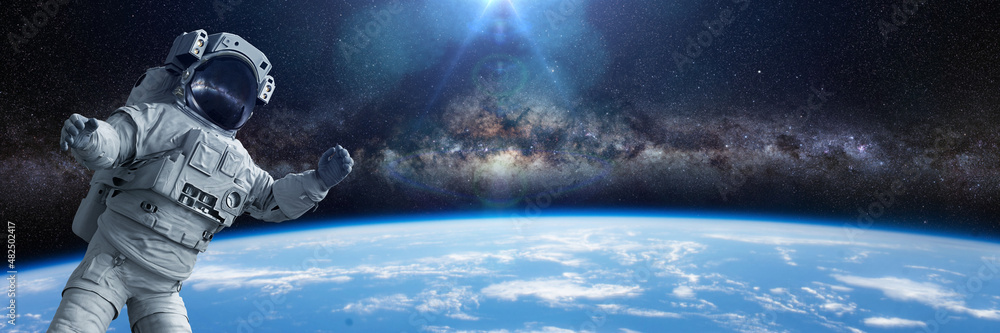 Sticker astronaut during a spacewalk in orbit of planet earth, background banner with empty space