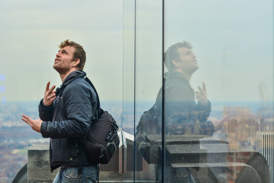 Fun pictures of a man facing glass reflection