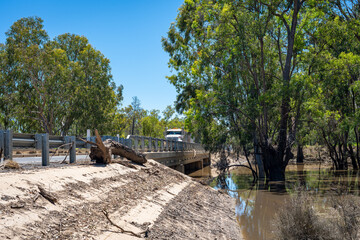 Truck crossing a bridge after the flood waters have receded, Chinchilla, Queensland, Australia