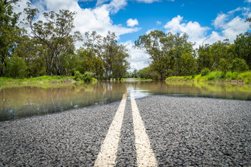 Fototapeta na wymiar If its flooded, forget it. Rising flood waters in Chinchilla, Queensland, Australia