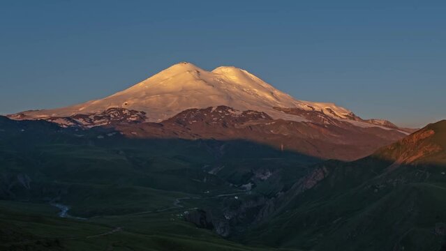 Beautiful view of Mount Elbrus at sunrise, North Caucasus mountains, Russia, timelapse 4k