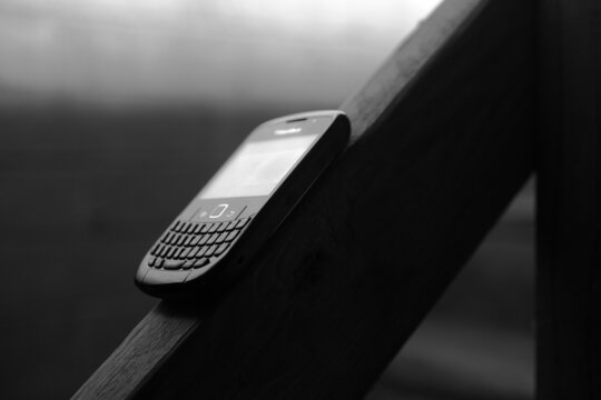 Blackberry phone on stairway bannister