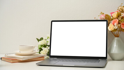 Close-up, a women's office desk with modern laptop computer